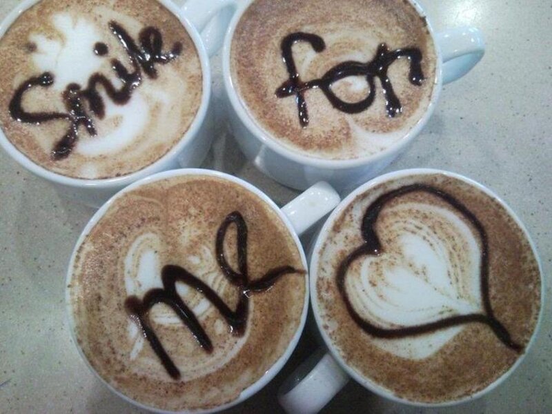 Four Coffee Cups with Latte Art