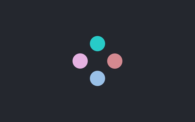 four colored circles on dark background