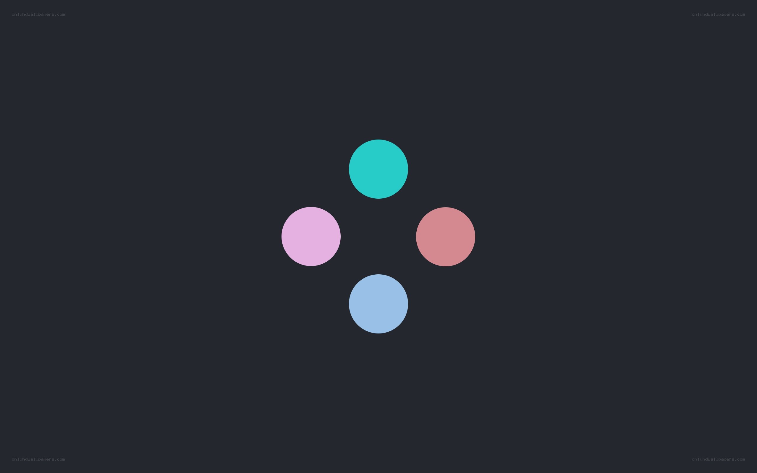 four colored circles on dark background