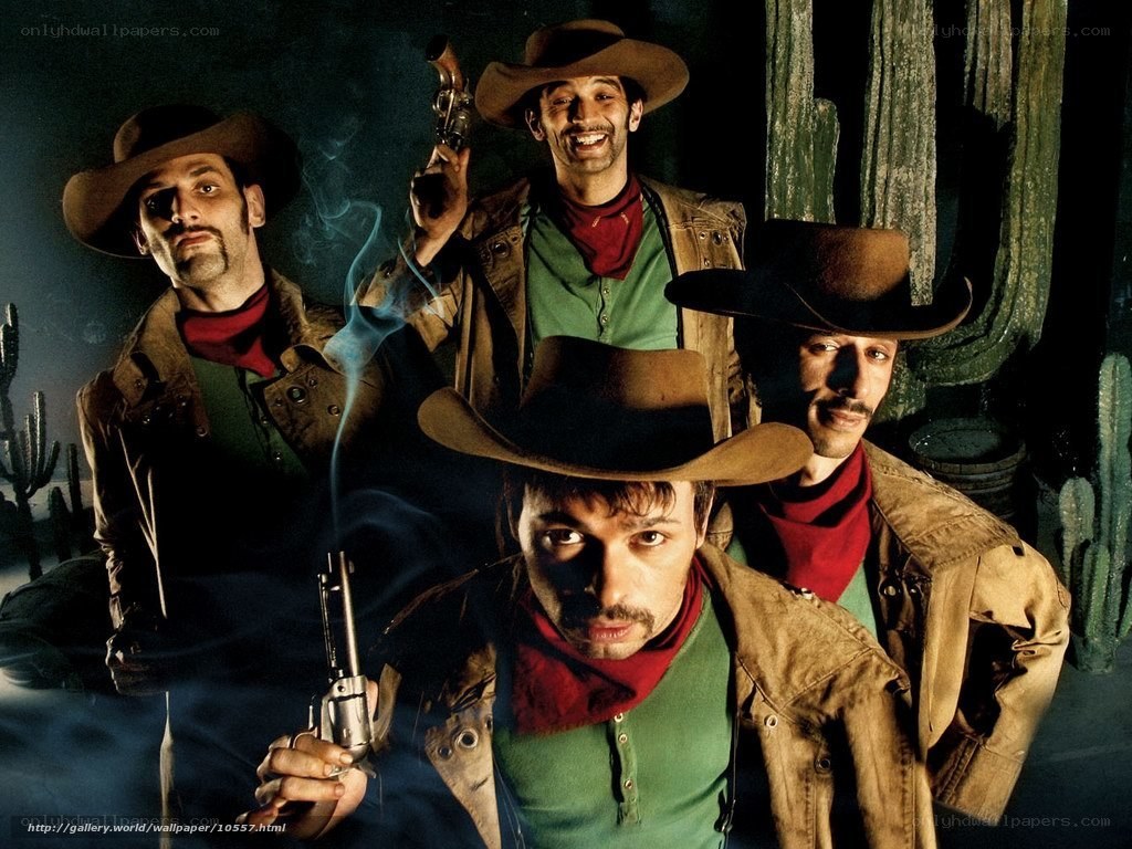 Four cowboys with guns