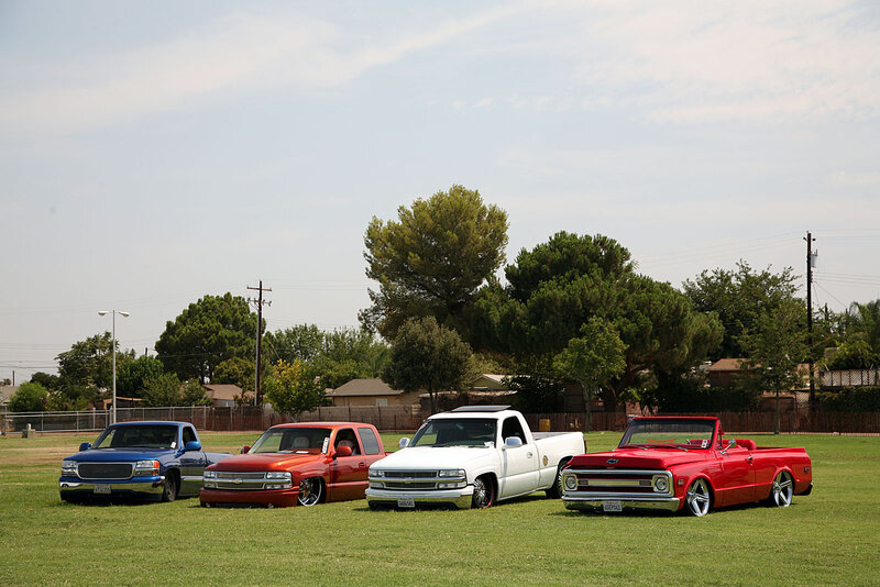 Four Custom Trucks on Grass