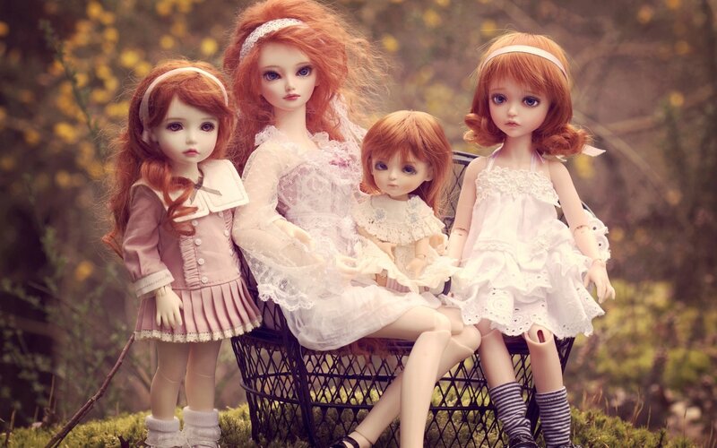 Four Dolls on Bench