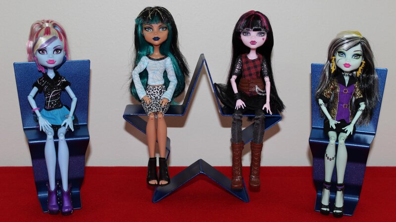 Four Dolls on Chairs