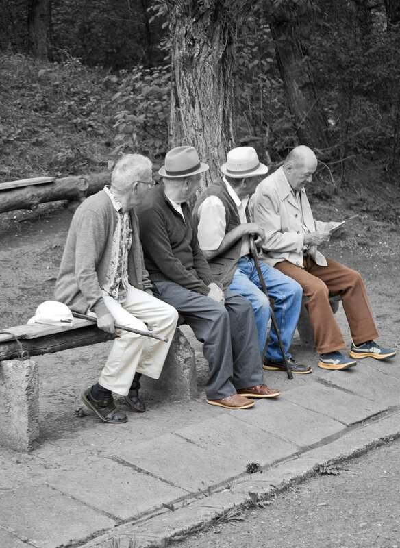 Four elderly men on a bench