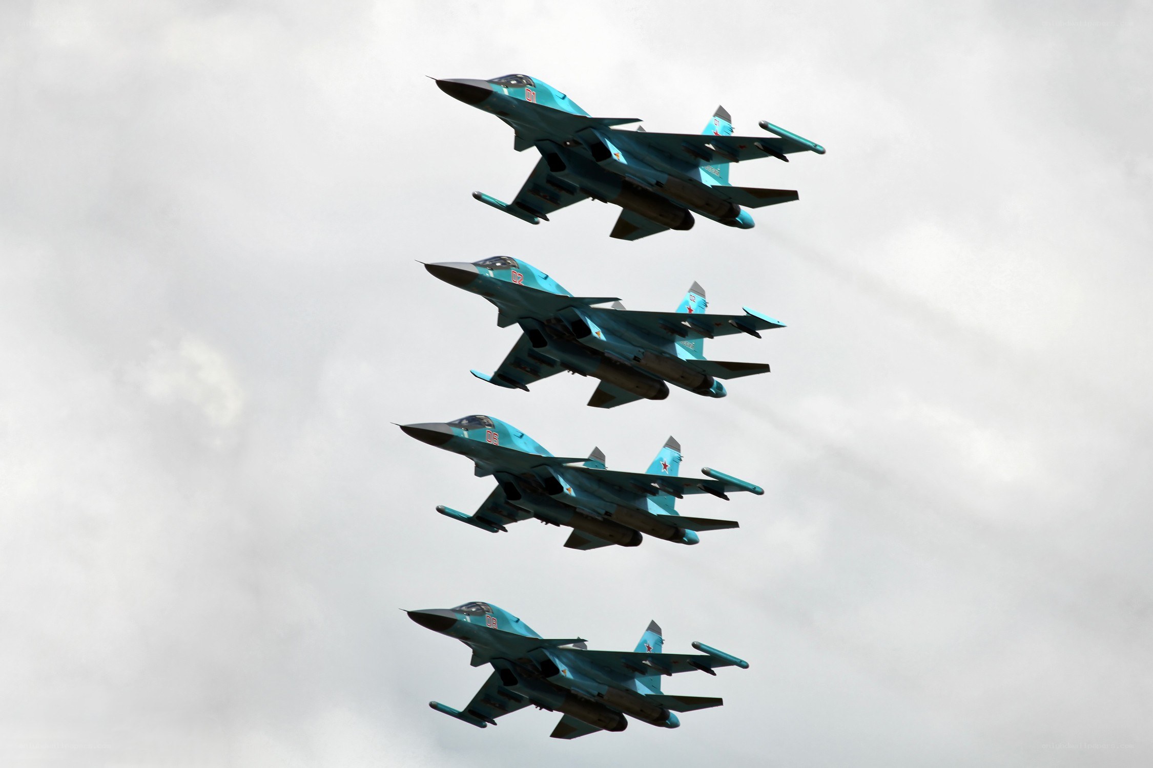 Four fighter jets in formation