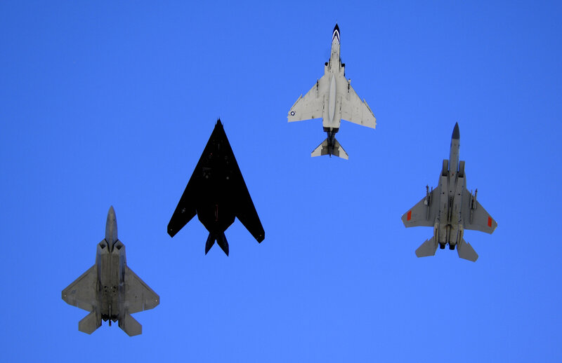 Four Fighter Jets in Formation — Blue, Dramatic, Afternoon