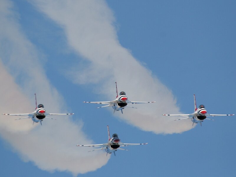 Four Fighter Jets in Formation — Blue, Dynamic, Afternoon, Photograph