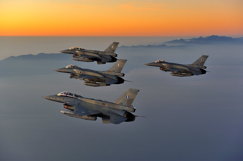 Four Fighter Jets in Formation — Orange