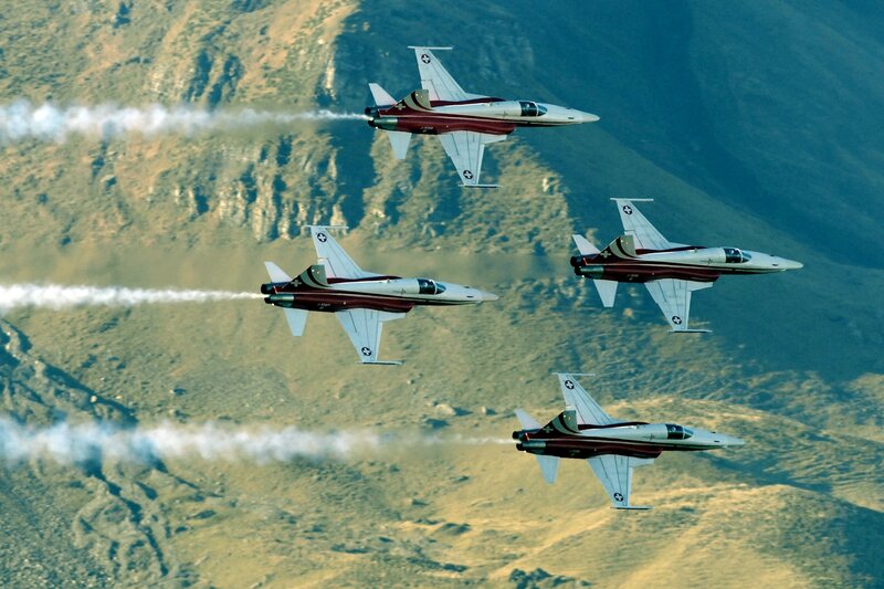Four Fighter Jets in Formation — White, Dramatic