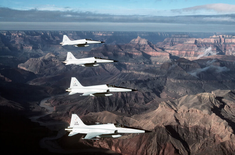 Four Fighter Jets in Formation — White