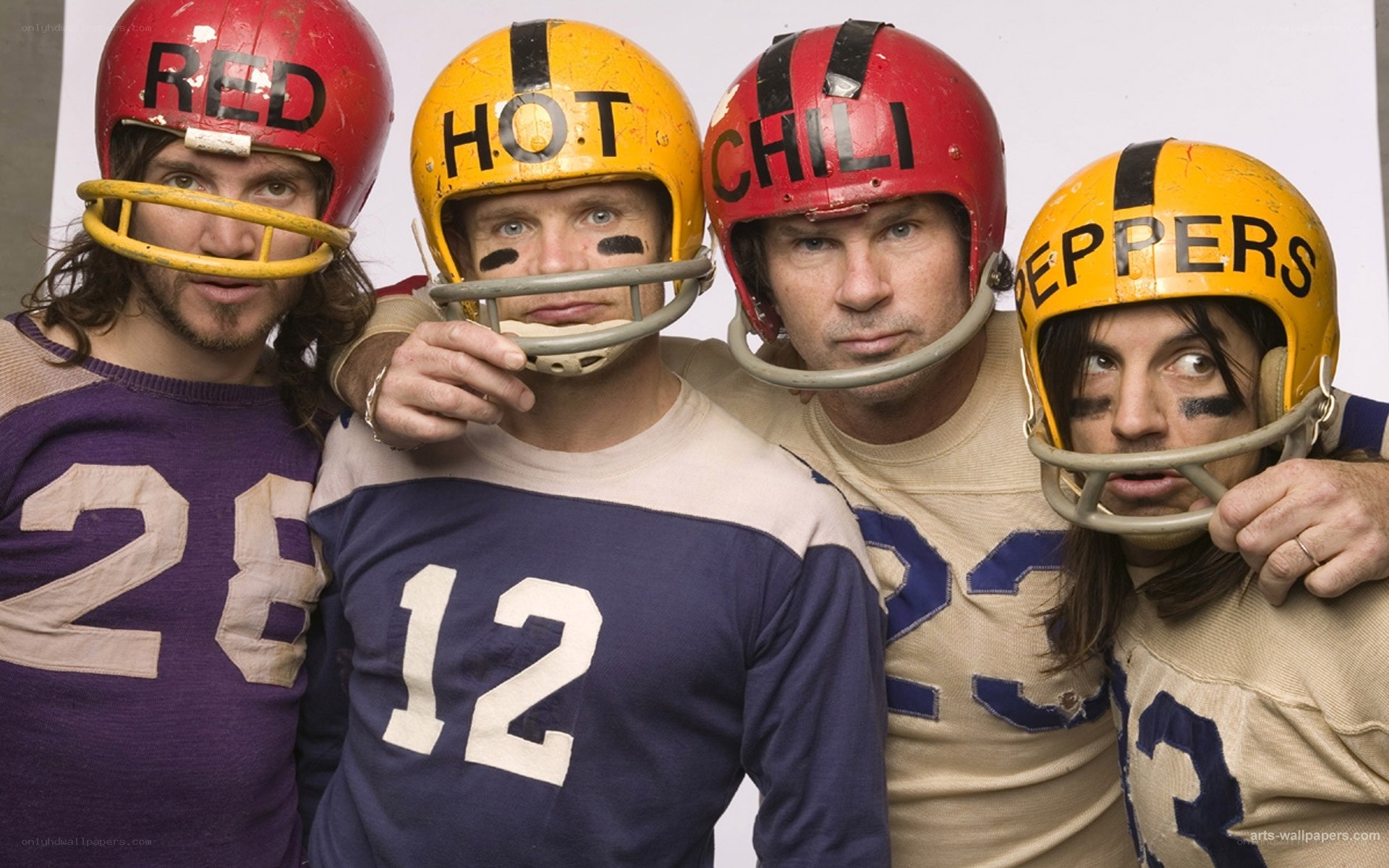 Four football players in vintage gear