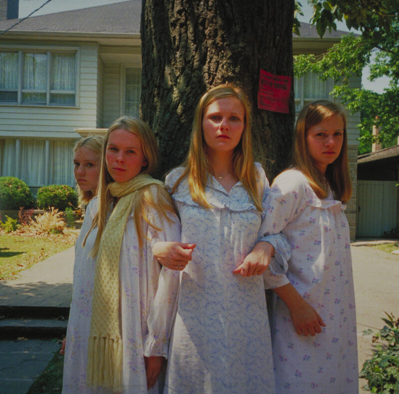 Four girls in floral dresses