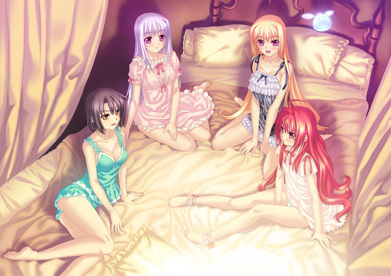 four girls in pajamas on a bed