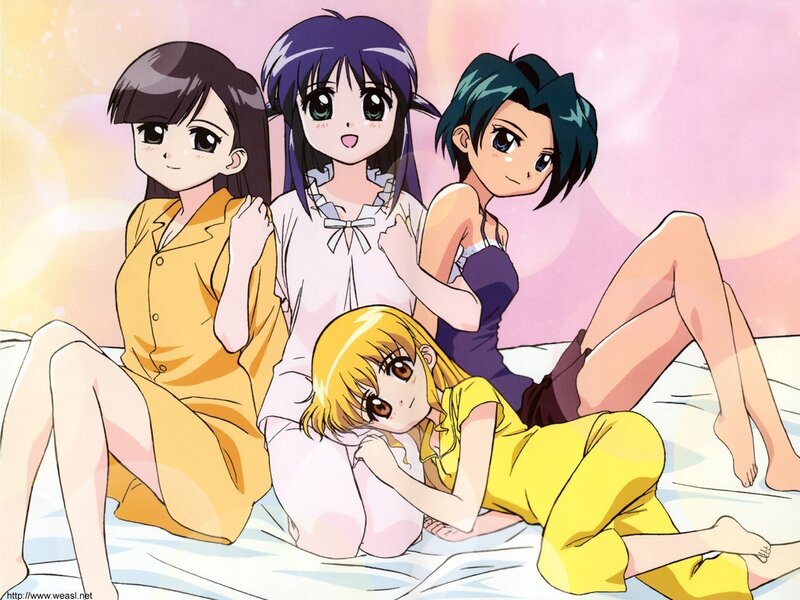 Four girls in pajamas on a bed