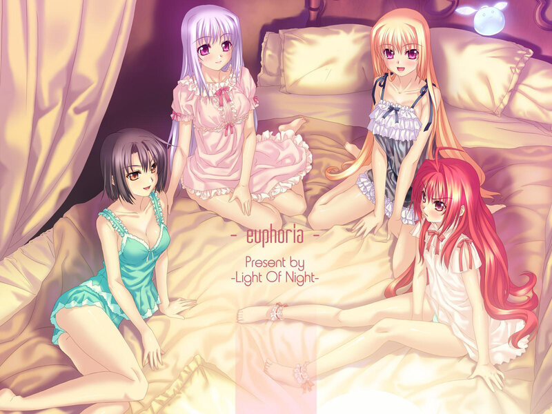 Four girls in pajamas on a bed