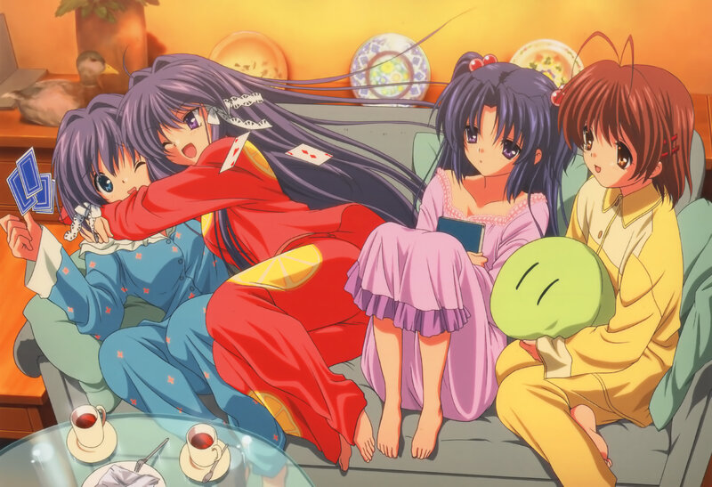 Four girls in pajamas on a couch