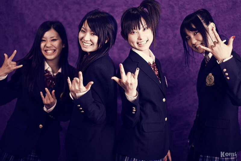 four girls in school uniforms