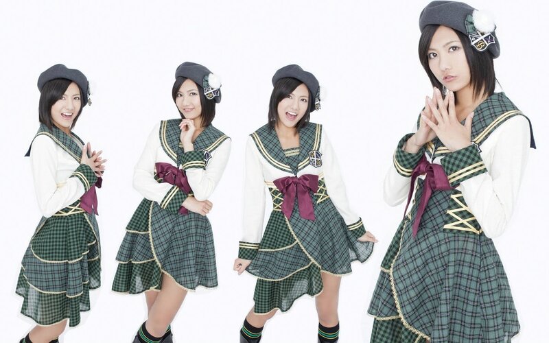 four girls in school uniforms
