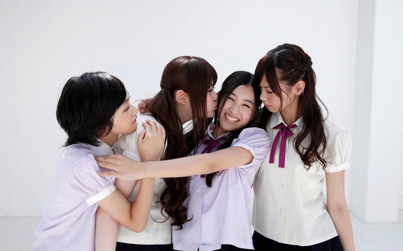 four girls in school uniforms