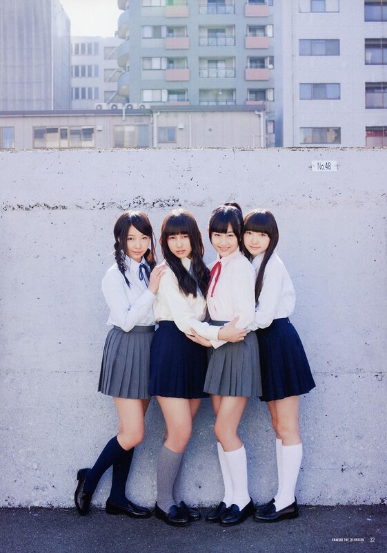 Four girls in school uniforms