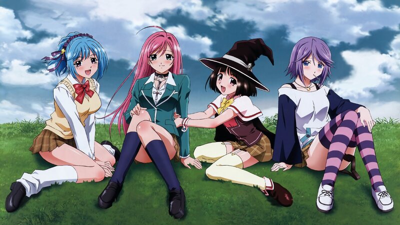 Four girls in school uniforms on grass