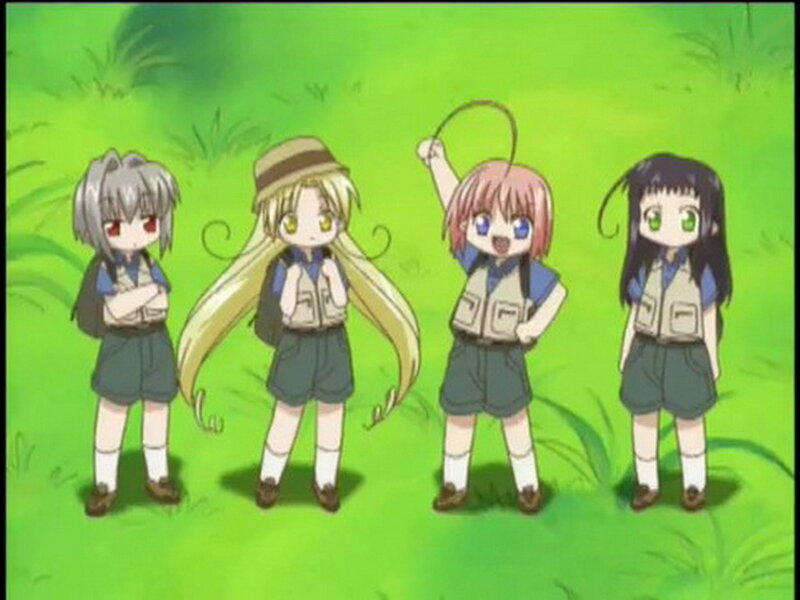 four girls in scout uniforms
