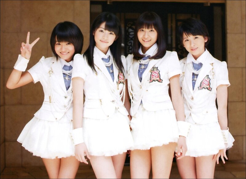 four girls in white uniforms