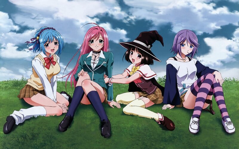 Four girls on a grassy field