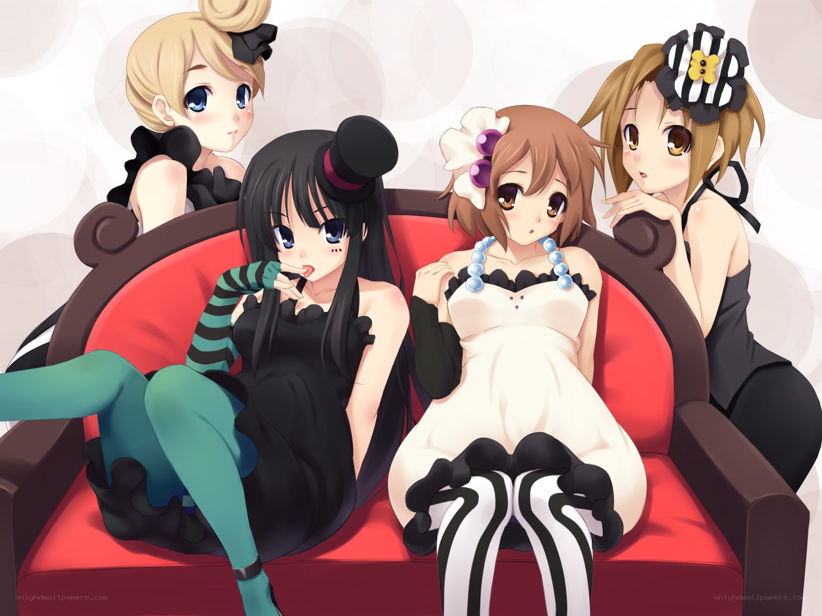 Four girls on a red couch