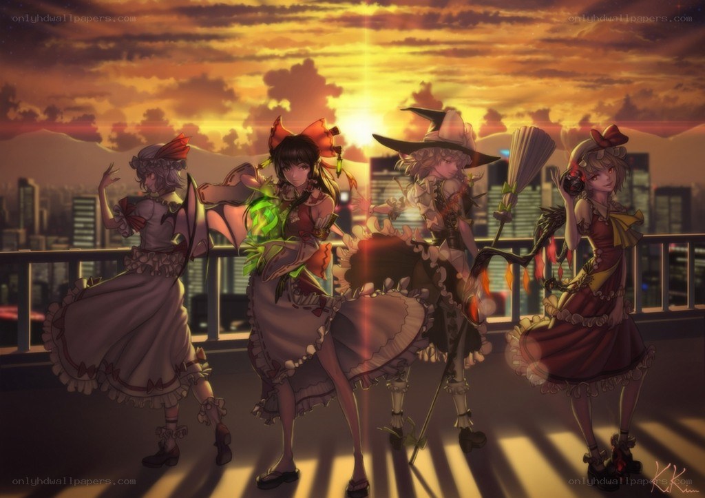 Four girls on a rooftop at sunset