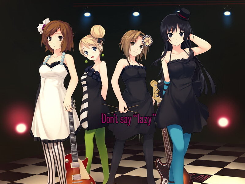 Four girls on a stage with instruments