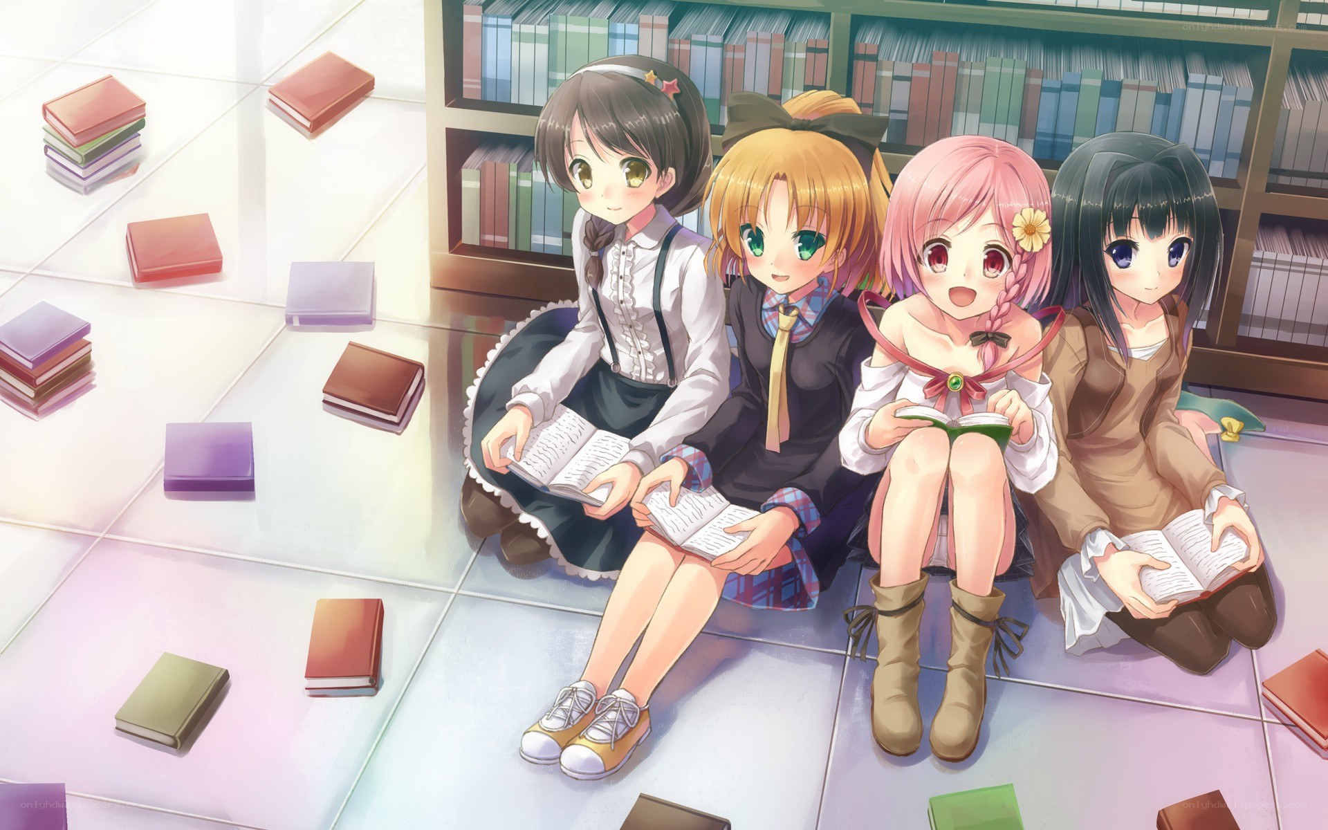 Four girls reading in a library