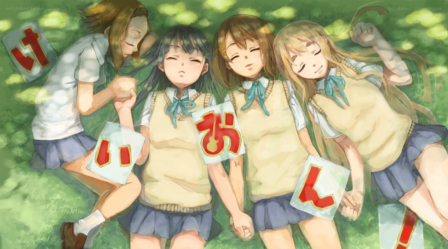 Four girls resting on grass