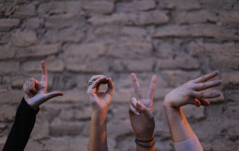 Four Hands Making Gestures
