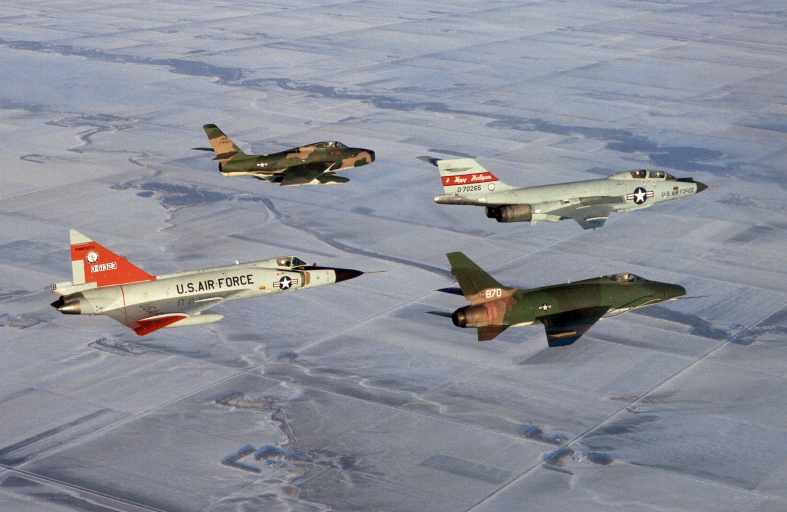Four jets in formation over snow
