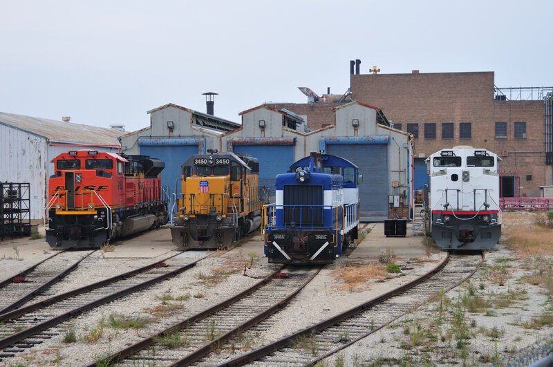 Four locomotives in a rail yard