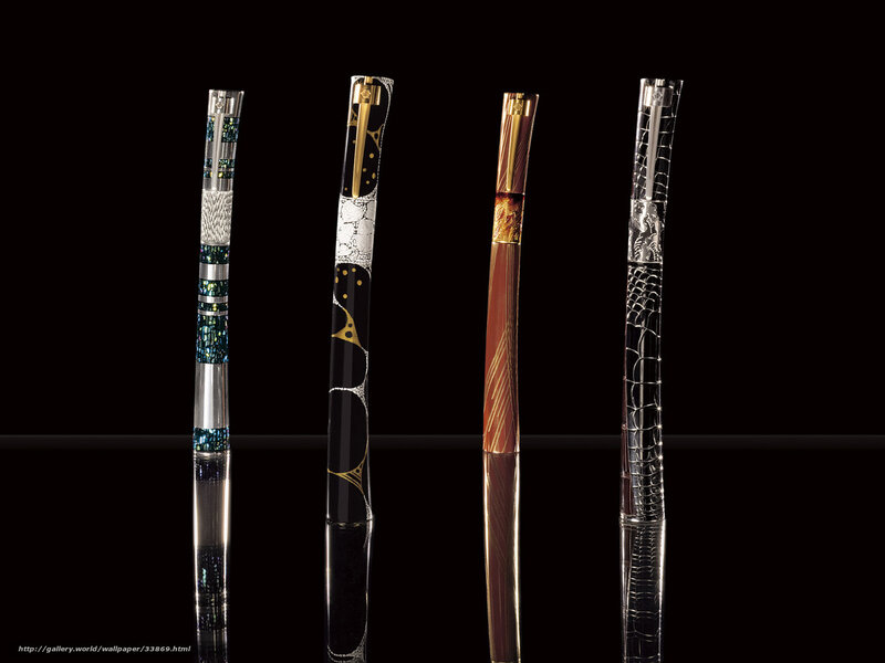 Four luxury pens on black