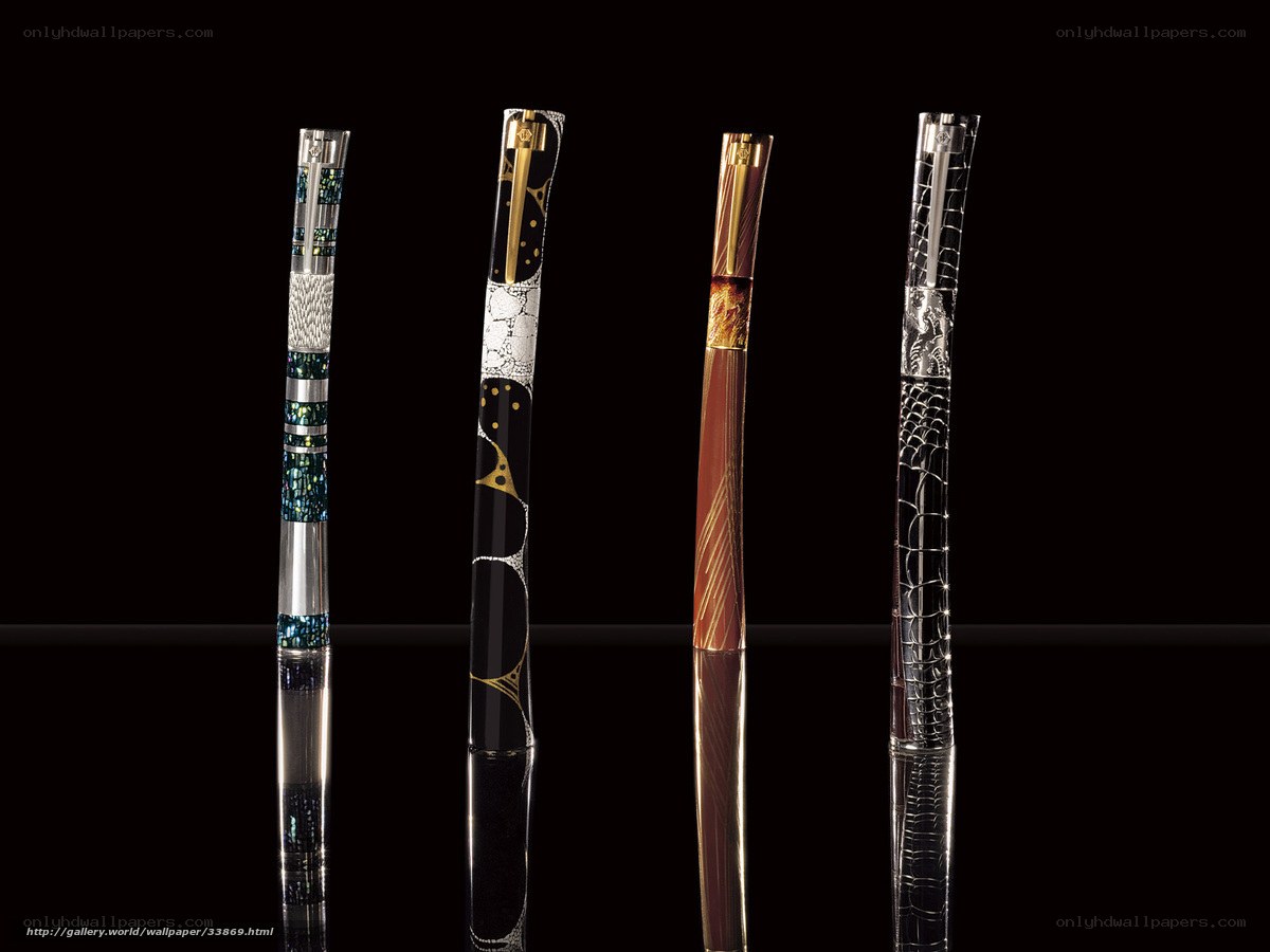 Four luxury pens on black