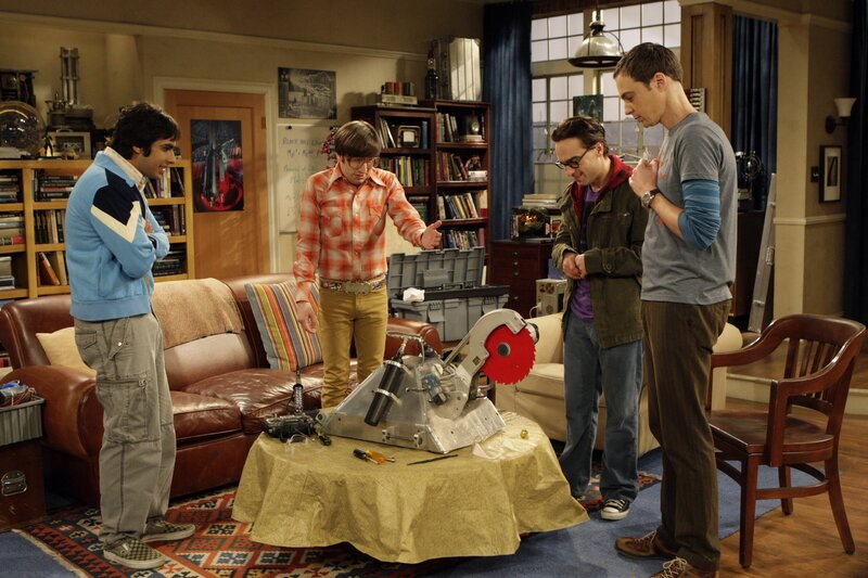 Four Men Around Machine