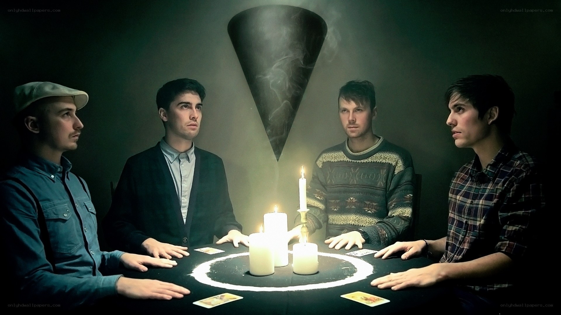 Four men at a séance table