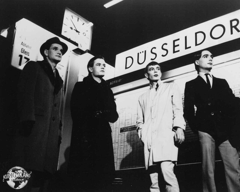 Four men at Düsseldorf station