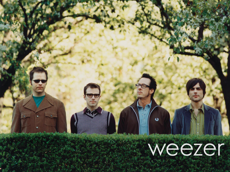Four Men Behind Hedge