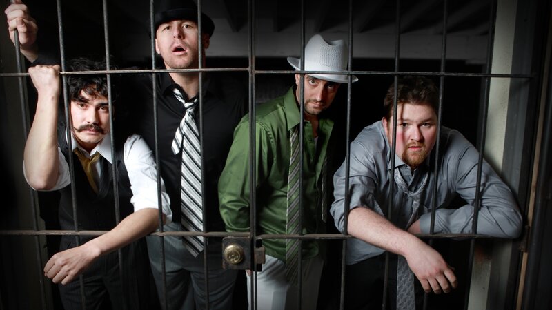 Four men behind prison bars