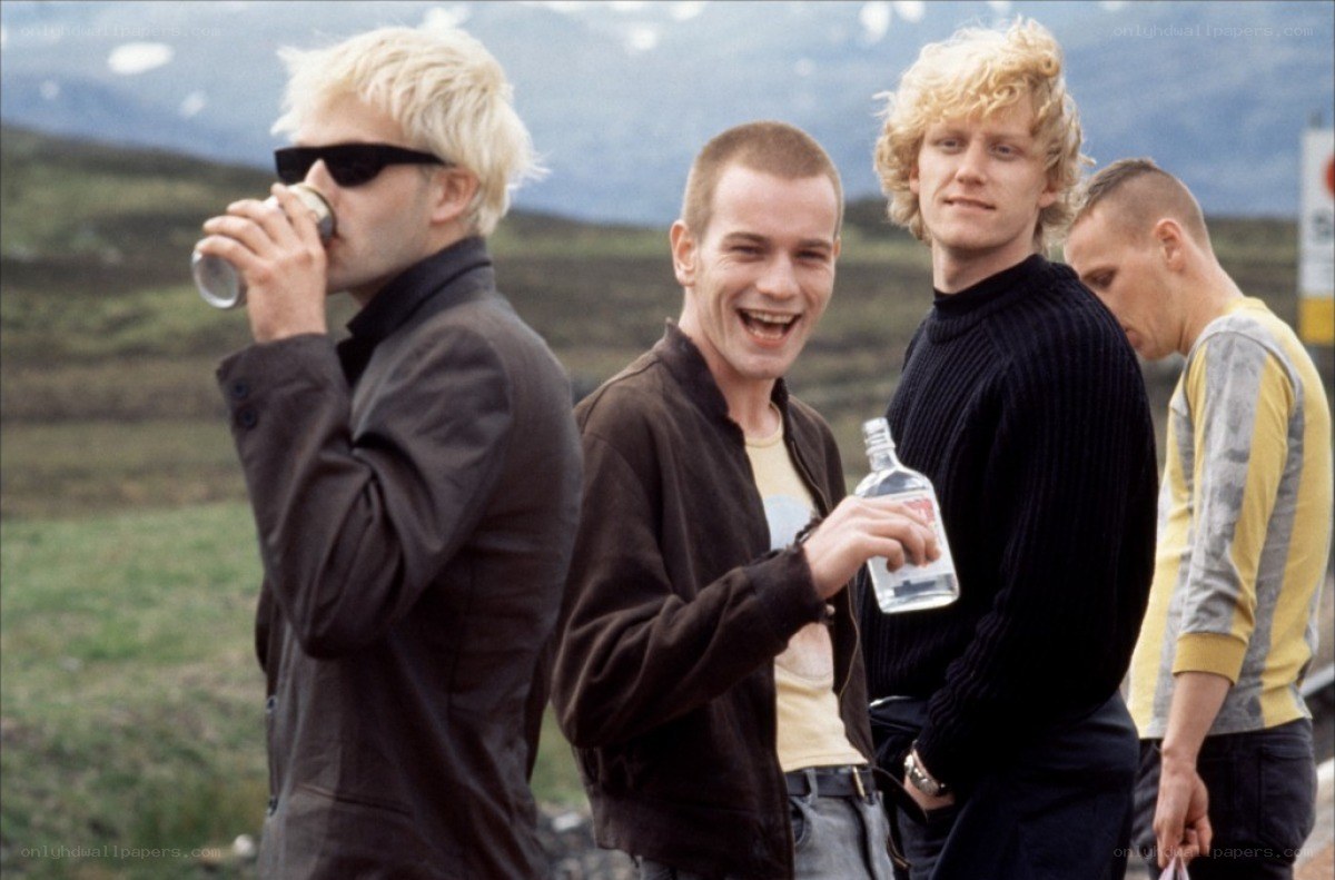 four men drinking outdoors
