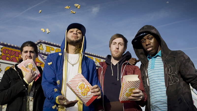 Four Men Eating Popcorn