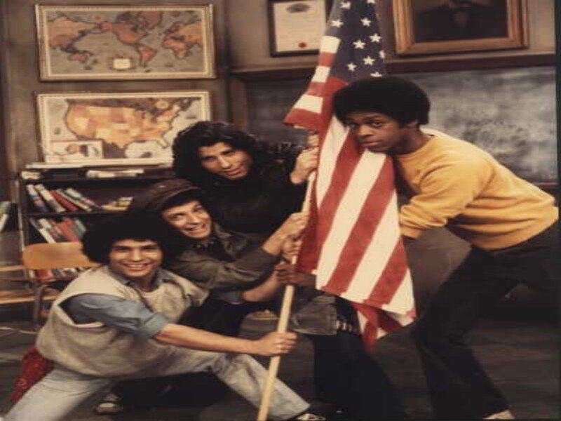 Four Men Holding Flag