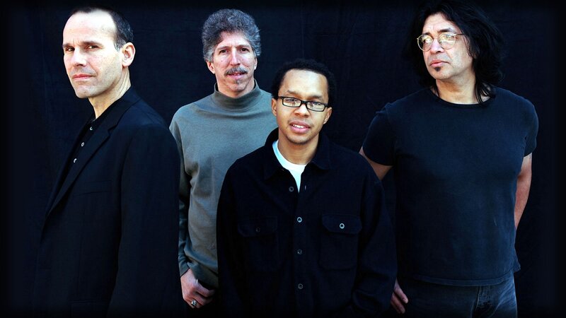 four men in a band photo