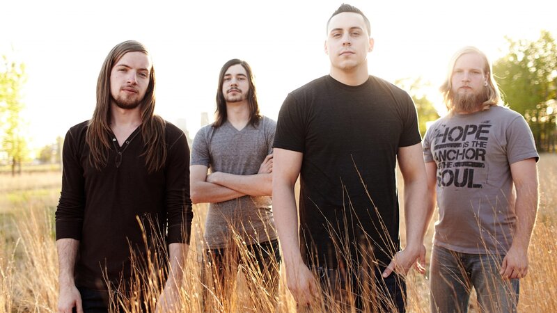 Four Men in a Field — Brown, Serious