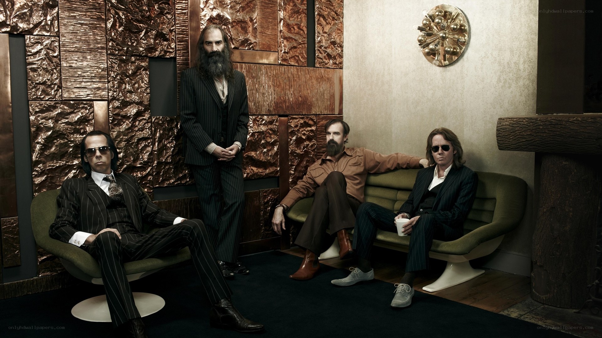 Four men in a stylish room