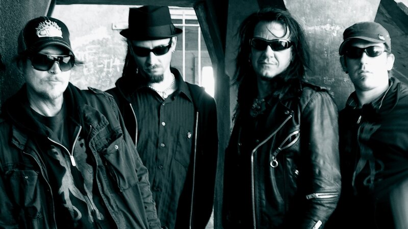 Four Men in Band Attire — Black, Serious